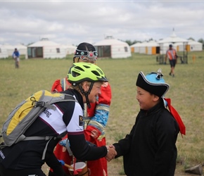 Muriel Thompson greets children at Ger Camp