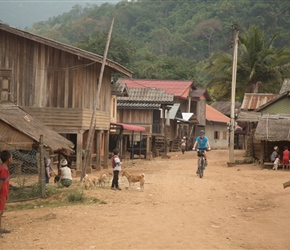 Sharon through local village, note the unmade road