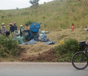 Frank passes Rice thrashing machine