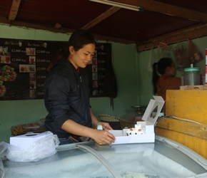 Packing a treat at the cake shop