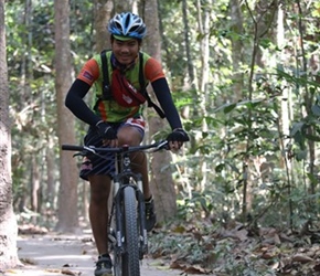 Our Cambodian guide Channy through woods in Angkor Wat complex