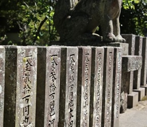 Carved stone pillars at Shinto Temple