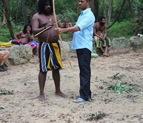 Narmal shooting arrows at the Veddah Village