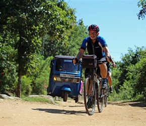 Phil pursued by a blue Tuk tuk