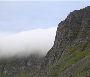 Clouds over cliff at Unstad