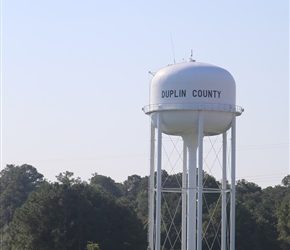 Sue and Tony pass a water tower in guess what County?