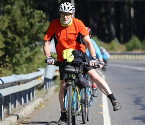 Steve stretches a leg on the road from Cunco