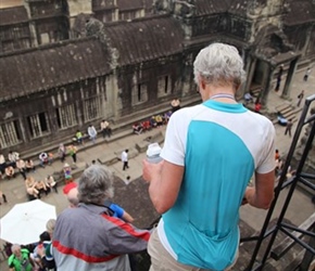 Carel descends steps from top part of Angkor Wat