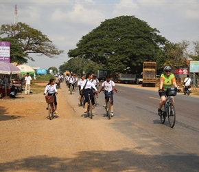 Jo passes children at Moung Roessei 