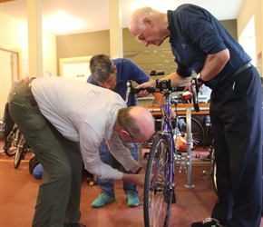 Ian helps to re-assemble the bikes after the flight