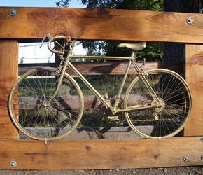 Golden bike on the outside gate at Sports Haus