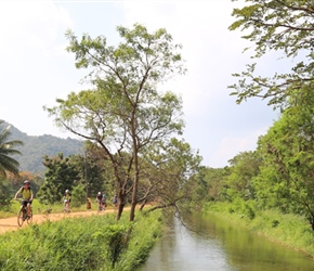 Malc on canal bank near Dambulla. The surface was firm and they were full of interest namely birdlife