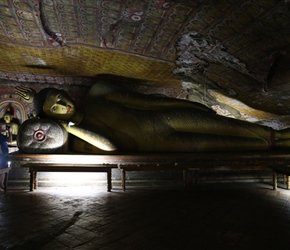 Phil takes a picture of a reclining Buddha in Dambulla