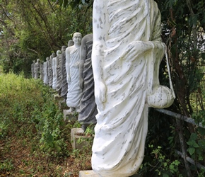 Row of model worshippers in Embilipitiya