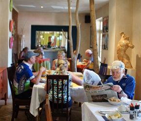 Roger reads the morning paper at breakfast at the Barrydale Hotel