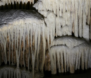 Postojna Cave is a 24,340 m long karst cave system near Postojna, southwestern Slovenia. It is the second-longest cave system in the country as well as one of its top tourism sites. The caves were created by the Pivka River.