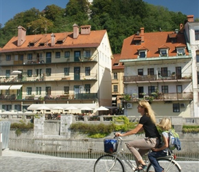 Mother and child cycling through Ljubliana