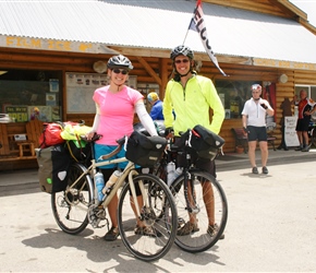 We're at a crossing point. Here two Trans American Cyclists take a break at Tomochi Trading Store