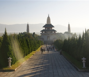 Walking away from the 3 pagodas and temple