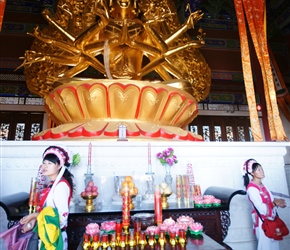 Tour guides and a multi handed buddha