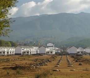 New housing estate, not a garden in site. The Chinese are renowned for building right to the edge of their plot