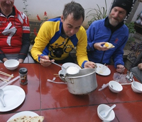 Graham scopes the bowl for the last of the breakfast rice porridge