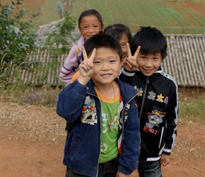 Children make the 'happy' sign