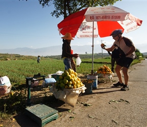 Frank stokes up on some oranges from a roadside seller