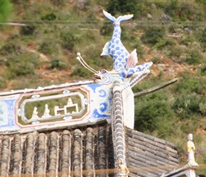 Fish decoration atop roof