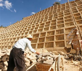 Passing bricks up the embankment