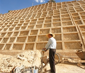 Passing bricks up to build the embankment