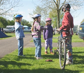 Kate, Louise and Emma offer sweets to James