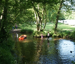 Louise and Lucy paddling in the stream that ran through the campsite