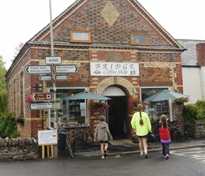 The Wheadons enter the Bridge Coffee House at Clun Bridge