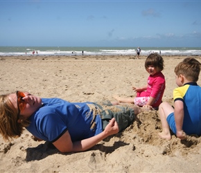 Gabriella and Jacob burying their mum at Pirou Plage