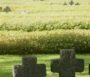 WW2 German cemetary markers at Marigny. Scattered stone crosses often in threes, quite a counterpoint to the white stones of the Commonwealth