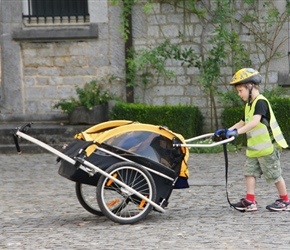 Jcob pushing the burley trailer which would carry Gabrielle, his sister