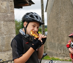 George wrestling a pain au raisin in Teutheville Bocage