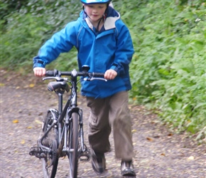 Oliver finishes the ride, pushing back up the drive