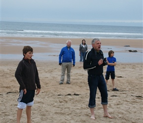 John and Matthew field on the beach