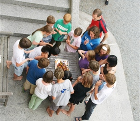 Gathering around the chocolate cake