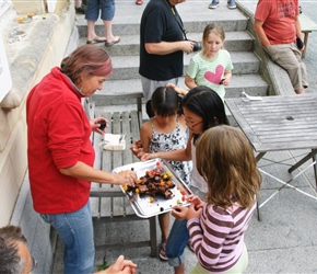 Anna takes a piece of cake at Chateau du Perron