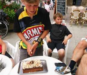 Edward slices the cake at Coutance. I bought this figuring that  whole cake split was cheaper than everyone buying a piece