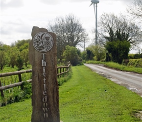 Thistledown sign. An eco friendly place as the wind turbine shows