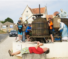 The children look somewhat perplexed as I hope against hope that their efforts will produce at least something from this wine making equipment