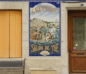 Enamelled creperie sign at Mortagne