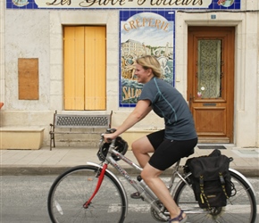 Emma passes the creperie sign at Mortagne