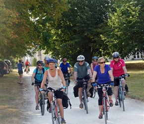 Emma leads the peloton out of the chateau