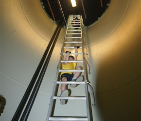 Jacob climbing the inside of the windmill. These ladders were in 4 stages with platforms in between