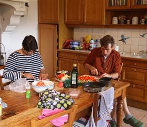 Mark and Rapinder preparing salad in the kitchen in the basement at Chateau de Perron